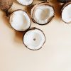 Coconut halves on a cream background